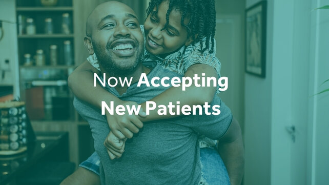 Image of dad and son with text "Accepting New Patients"