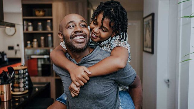 Father and son smiling