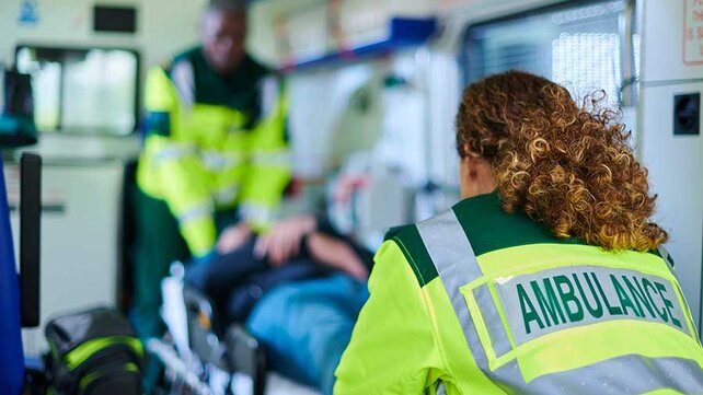 Paramedics with patient in ambulance