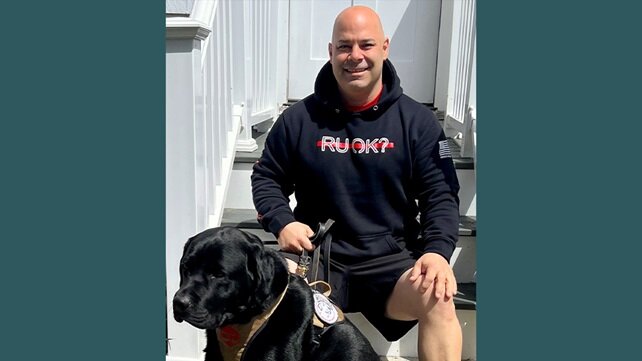 Mark Pavao with his black lab