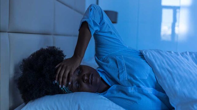 Women with insomnia in bed