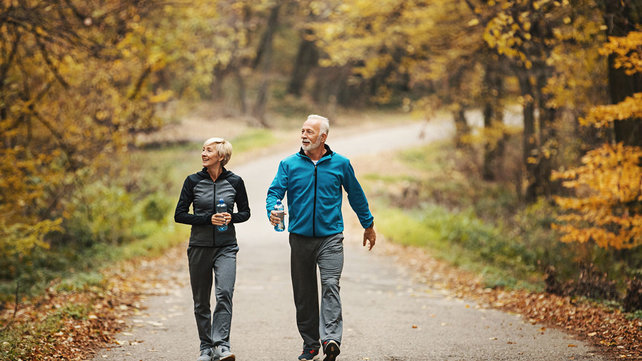 healthy older couple on an autumn walk