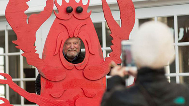 Walter Kalisz posing for a photo as a lobster.